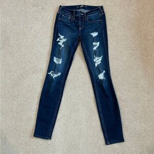 Hollister distressed dark blue low rise super skinny jeans in size 2L or 26L